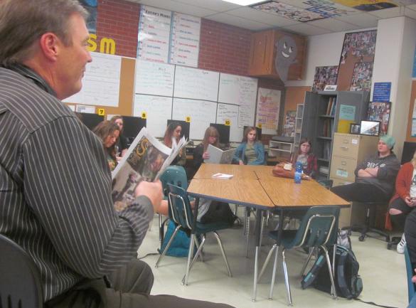 Great Falls Public Schools Assistant Superintendent Tom Moore discusses the journalism program with newspaper students at C. M. Russell High School on Nov. 10.